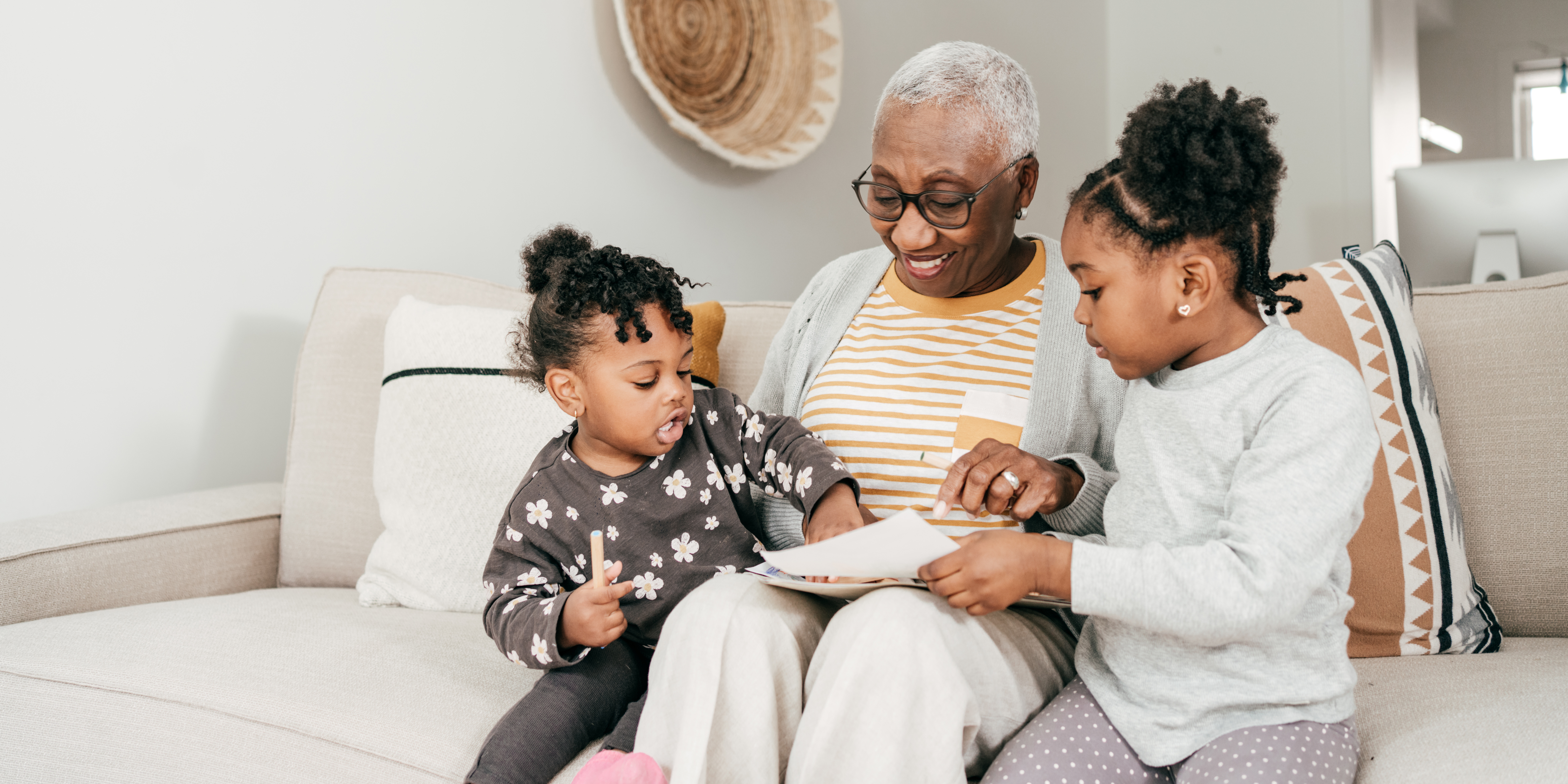 Grandmother spending time with grandchildren at home, showing support and stability during family changes and divorce