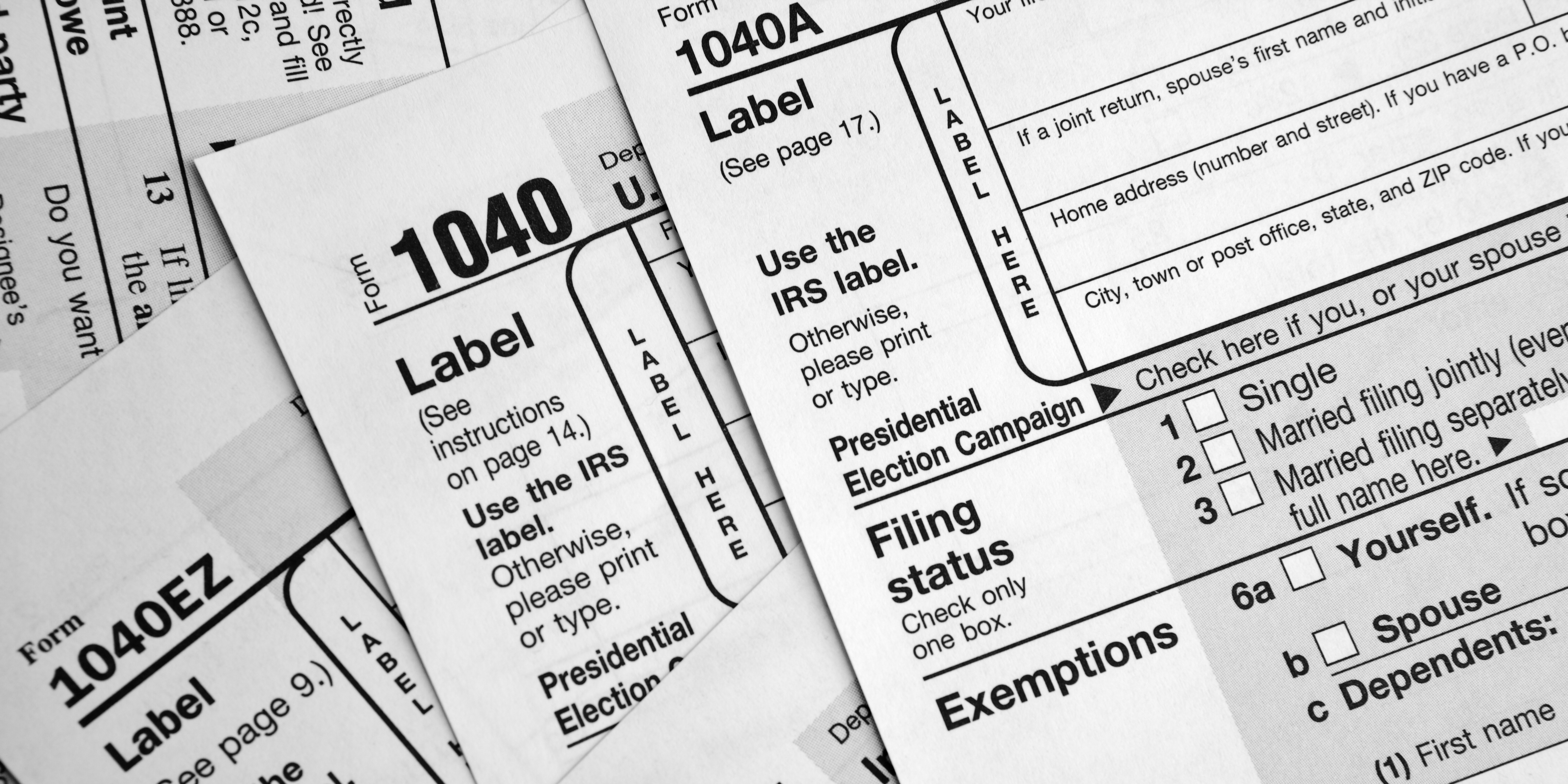 Stacked IRS 1040 tax forms illustrating changes to spousal support tax deductibility under the 2019 federal tax law