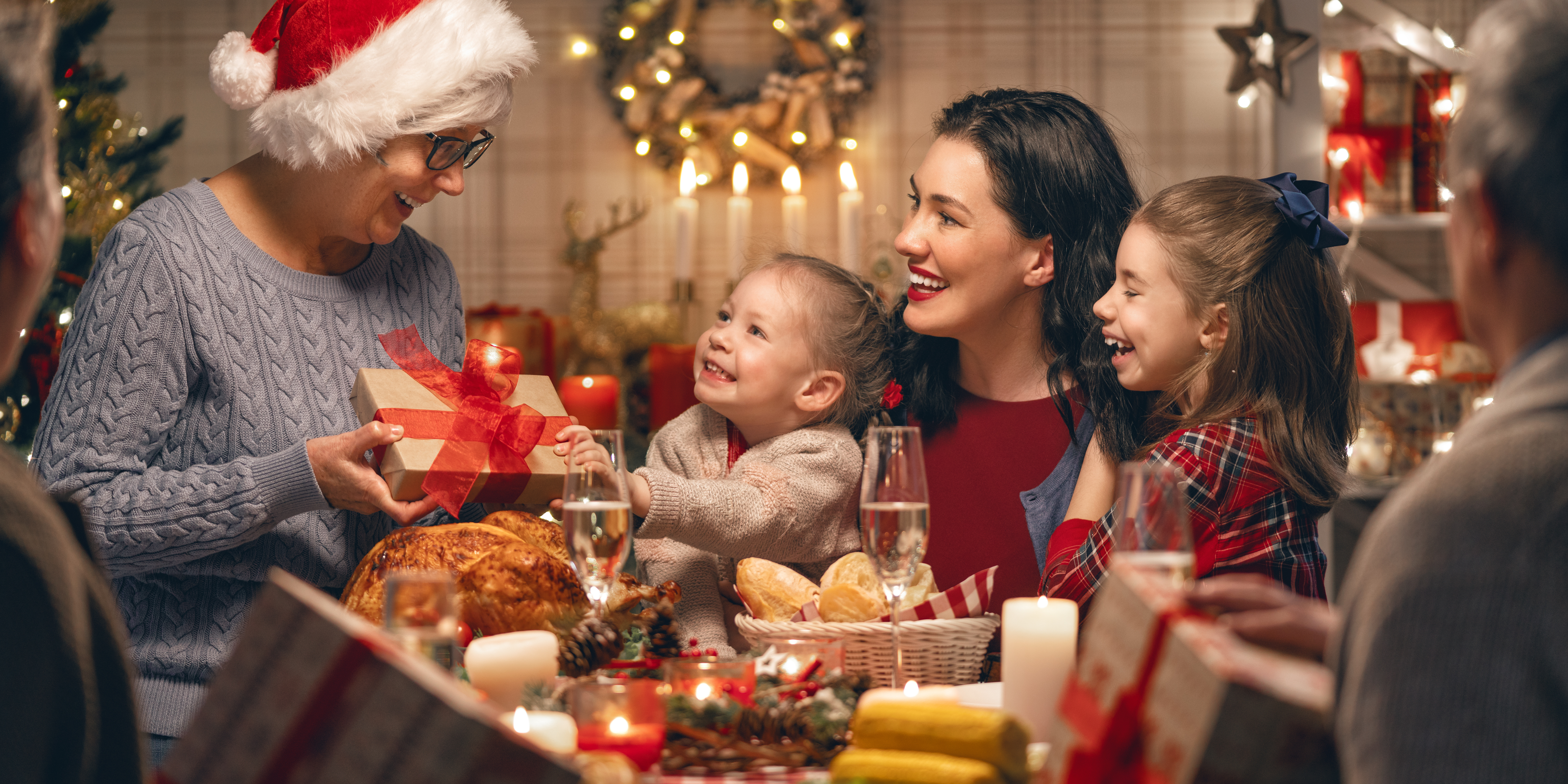 Family celebrating a holiday meal together, representing co-parenting and creating new traditions after divorce